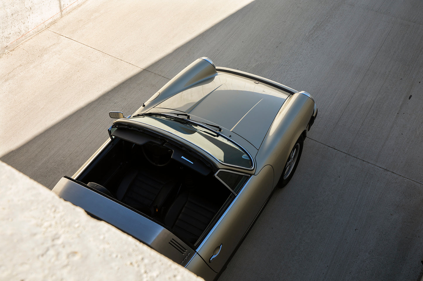 1975 Porsche 911S Targa framed by concrete.