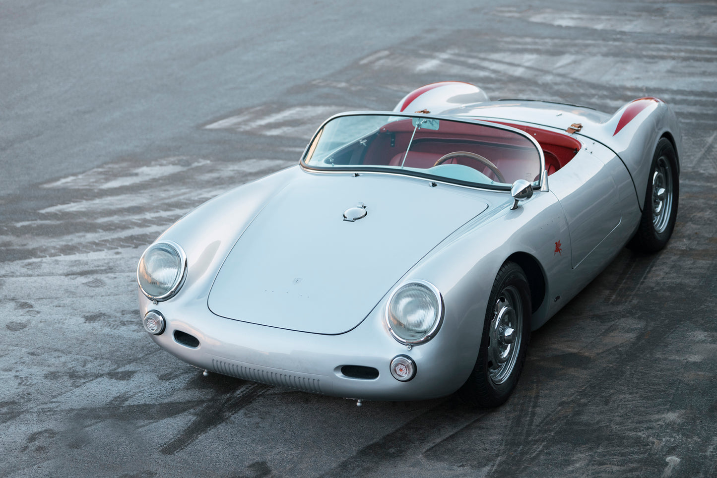 A beautiful 1955 Beck 550 Spyder classic car on the tarmac.