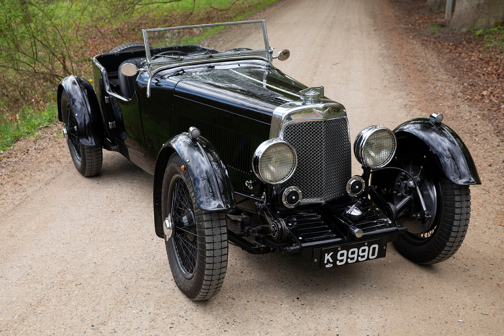 1933 Aston Martin Le Mans Short Chassis parked on forest road.