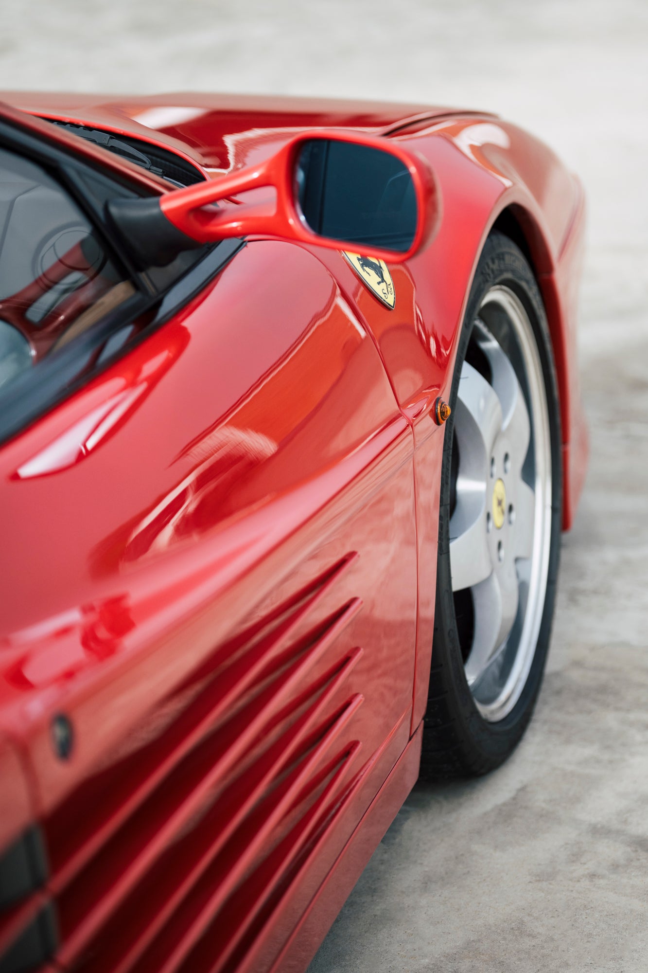 Side-view mirror. 1991 Ferrari Testarossa.