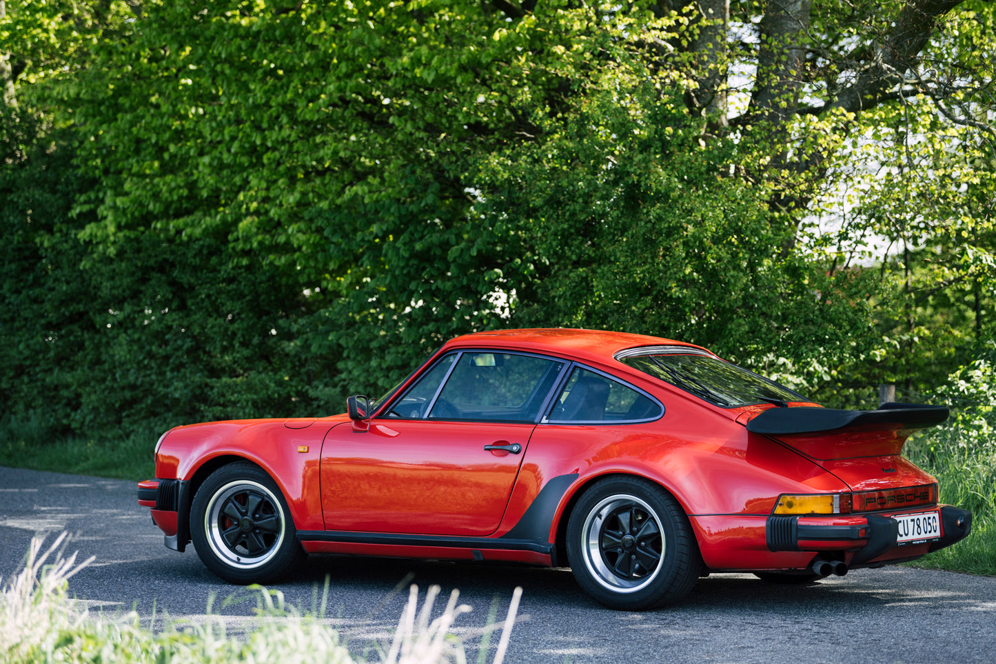 Idyllic side view of 1979 Porsche 930 Turbo 3.3 Litre on a country road.