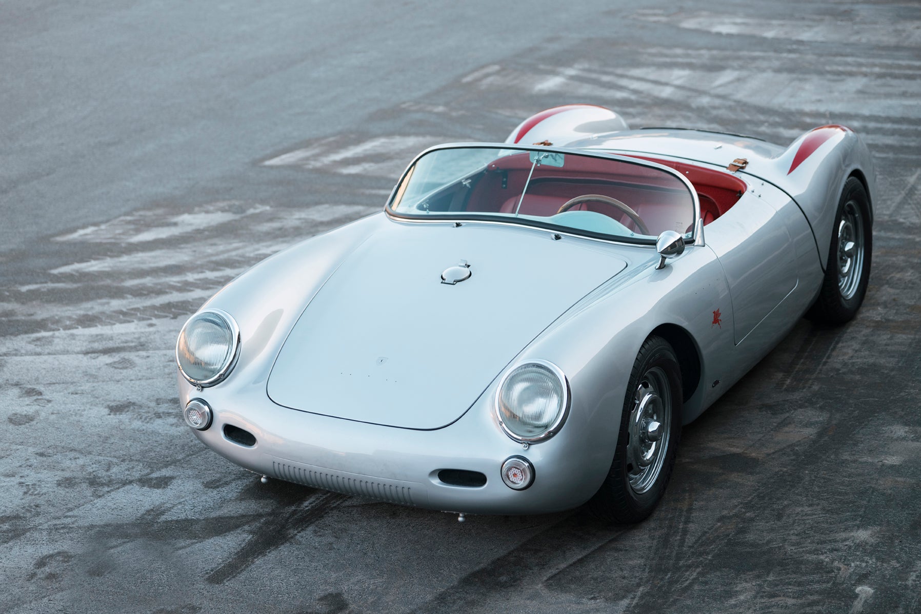 A beautiful 1955 Beck 550 Spyder classic car on the tarmac.