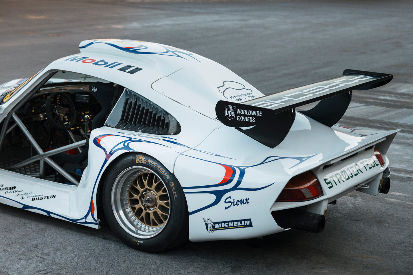 Open door revealing cabin. 1997 Porsche 911 GT1.
