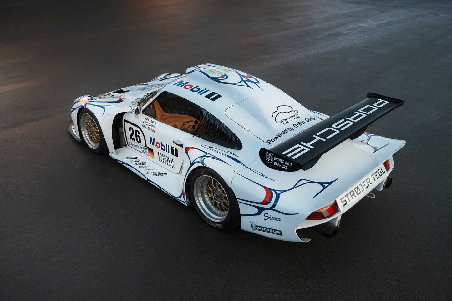 Streamlined 1997 Porsche 911 GT1 for sale.
